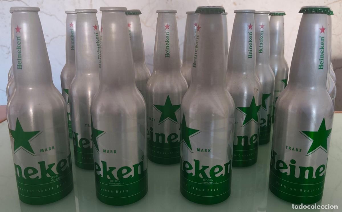 Coleccionismo de cervezas: LOTE DE 22 BOTELLAS DE ALUMINIO VAC&Iacute;A DE HEINEKEN CON EL EFECTO ESPECIAL ''BLACKLIGHT'' (A&Ntilde;O 2014)