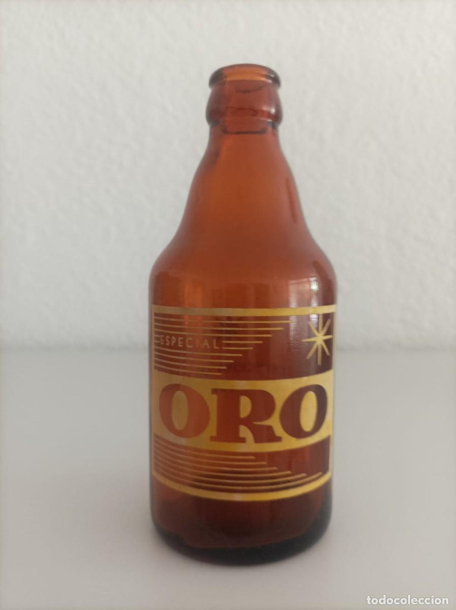 Coleccionismo de cervezas: Botella cerveza antigua oro-Ojo Leer-