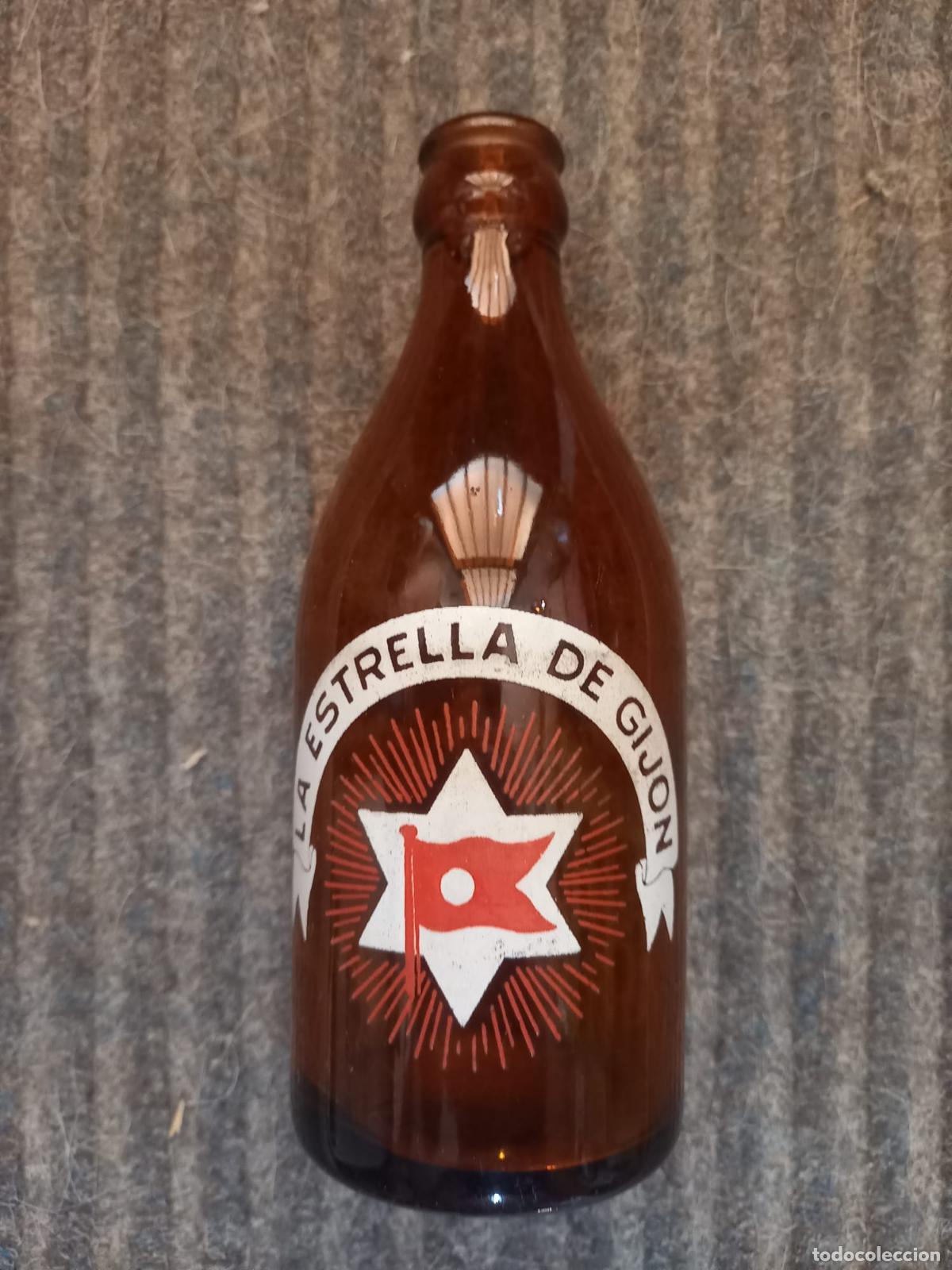 Coleccionismo de cervezas: BOTELLA CERVEZA *LA ESTRELLA DE GIJON* 33 CL.-MOD.1- REVERSO: SUARDIAZ Y COMPA&Ntilde;IA(S.EN C.)SERIGRAFIA