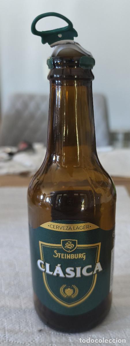 Coleccionismo de cervezas: BOTELLA VAC&Iacute;A CON ETIQUETAS y CHAPA TAPON CORONA CERVEZA - STEINBURG CLASICA