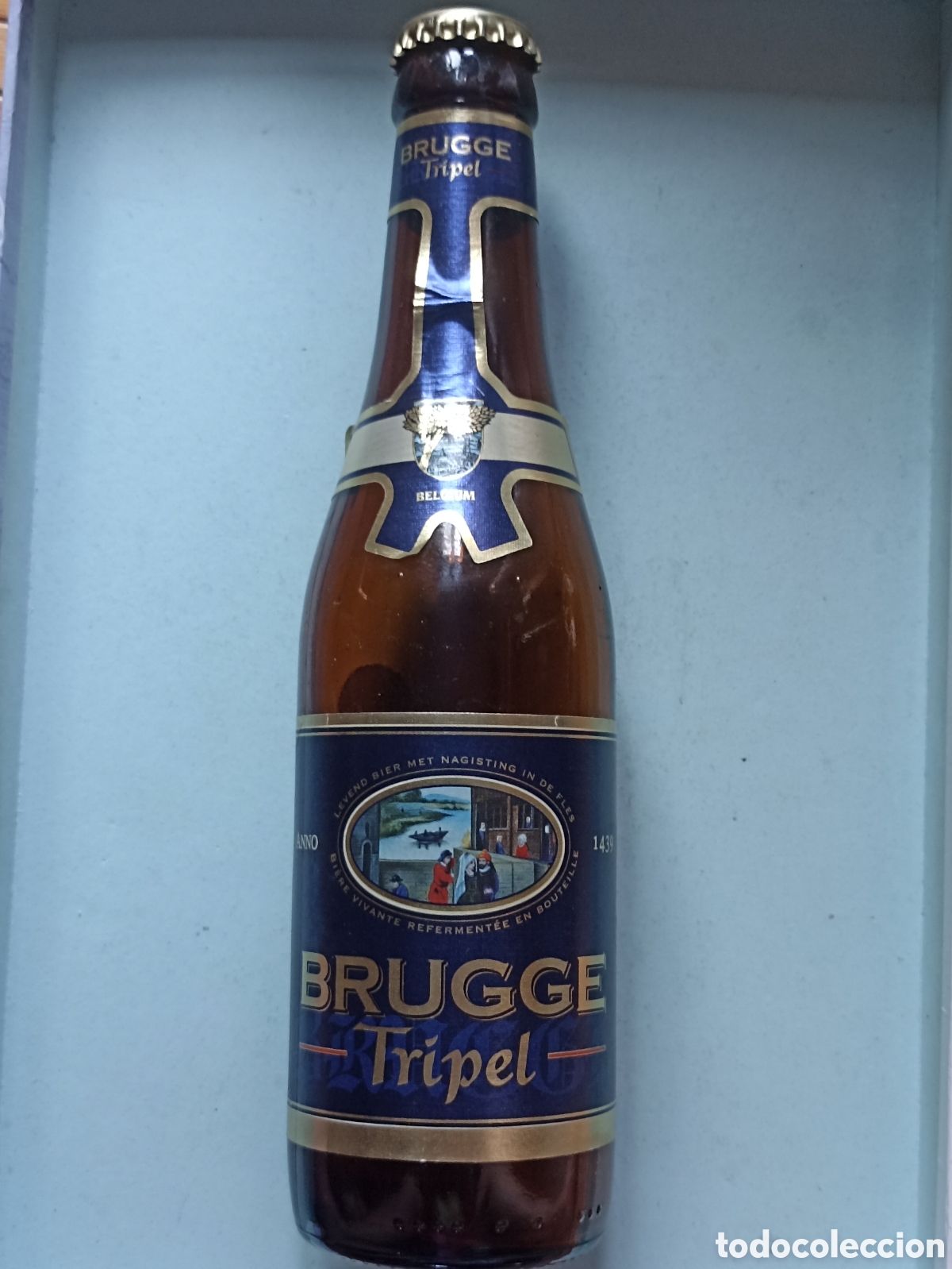 Coleccionismo de cervezas: Botella cerveza Brugge Tripel vac&iacute;a con chapa 330 ml