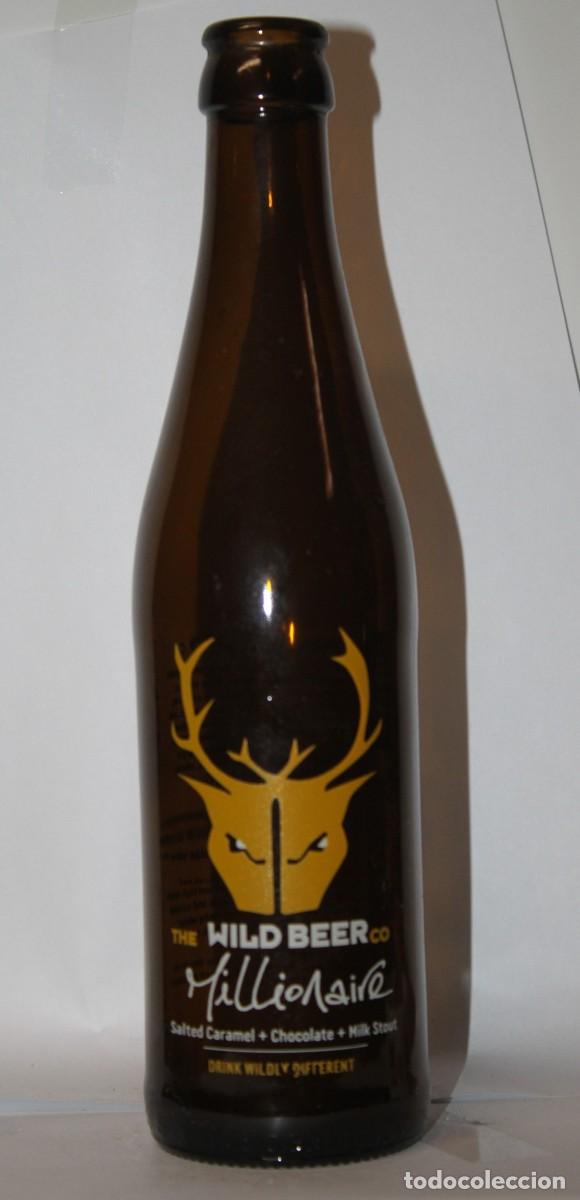Coleccionismo de cervezas: BOTELLA WILD BEER MILLIONAIRE 33 CL. VACIA