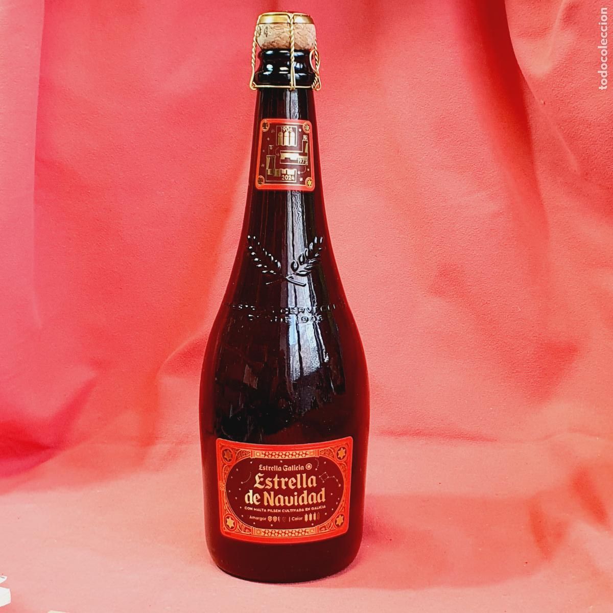 Coleccionismo de cervezas: BOTELLA-ESTRELLA DE NAVIDAD-ETIQUETA ROJA-2024-CAD.2025-COMO NUEVA-COLECCIONISTAS.