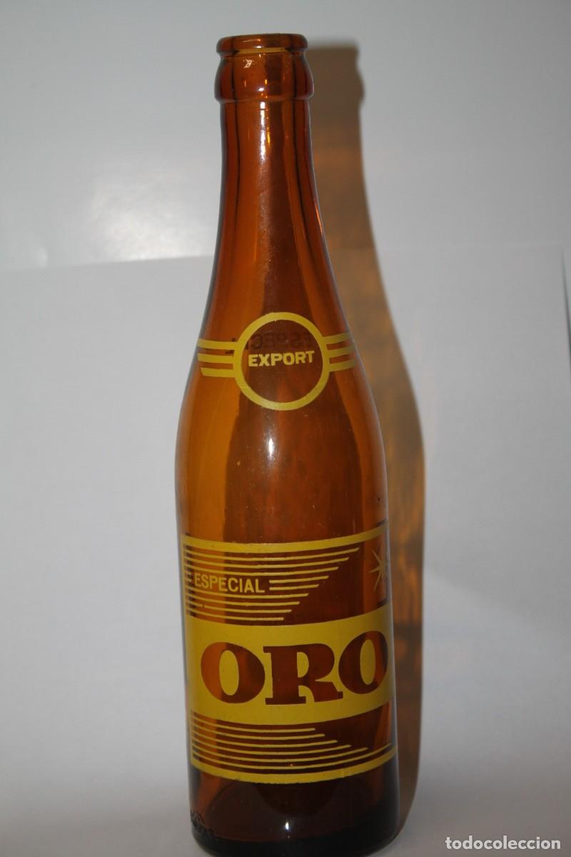 Coleccionismo de cervezas: ANTIGUA BOTELLA CERVEZA ORO 33 CL.