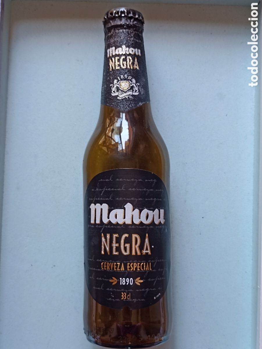 Collectionnisme de bi&egrave;res: Botella cerveza Mahou negra vac&iacute;a con chapa 330 ml