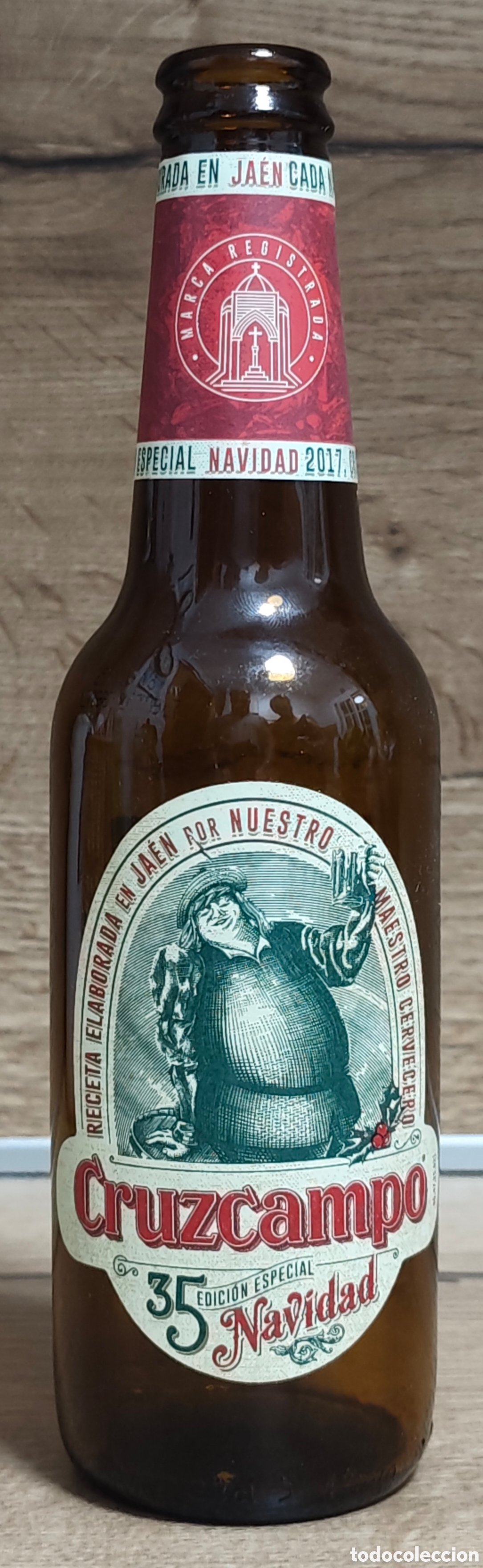 Coleccionismo de cervezas: BOTELLA VAC&Iacute;A DE CERVEZA CRUZCAMPO 35 EDICI&Oacute;N ESPECIAL NAVIDAD - 33 Cl.