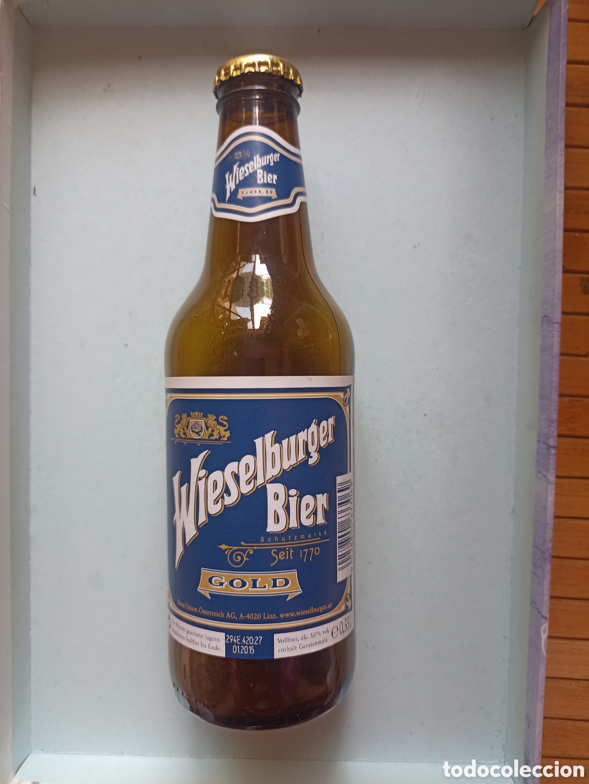 Coleccionismo de cervezas: Botella cerveza Wieselburger gold vac&iacute;a con chapa 330 ml