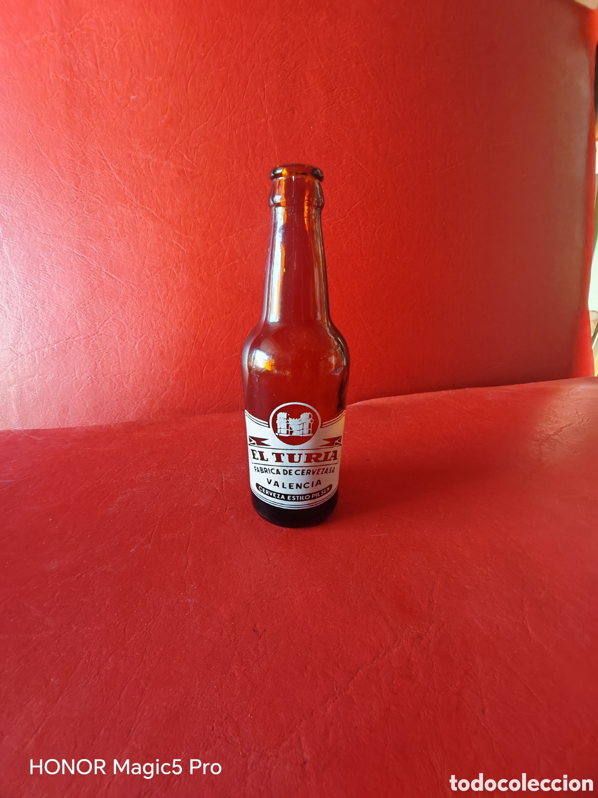 Coleccionismo de cervezas: Antigua botella de cerveza el Turia de un tercio,1/3 -serigrafiada en blanco