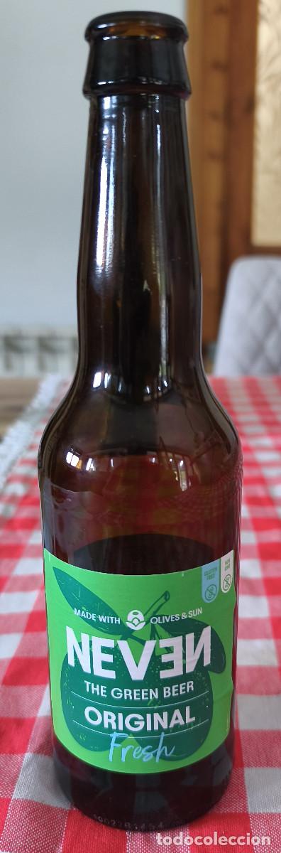 Coleccionismo de cervezas: BOTELLA VAC&Iacute;A CON ETIQUETAS y CHAPA TAPON CORONA CERVEZA - NEVEN ORIGINAL