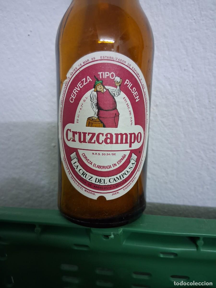Coleccionismo de cervezas: Botella cerveza LA CRUZ DEL CAMPO CRUZCAMPO SEVILLA Ja&eacute;n Ciudad Real quinto etiqueta a&ntilde;o 1988 1989
