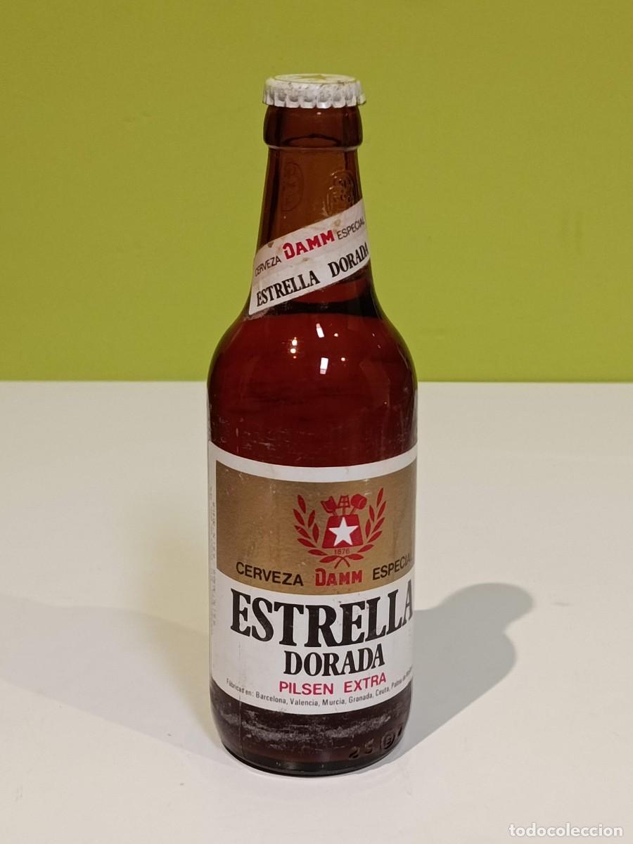 Coleccionismo de cervezas: Antigua botella Estrella Dorada Damm Pilsen Extra a&ntilde;os 80