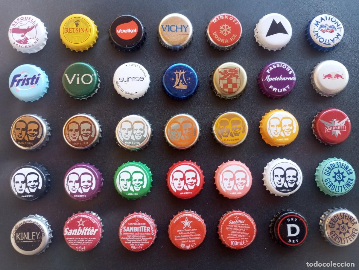 Coleccionismo de cervezas: Lote de 35 chapas tap&oacute;n corona usadas DIFERENTES, de refrescos, zumos, aguas, ... etc (P)