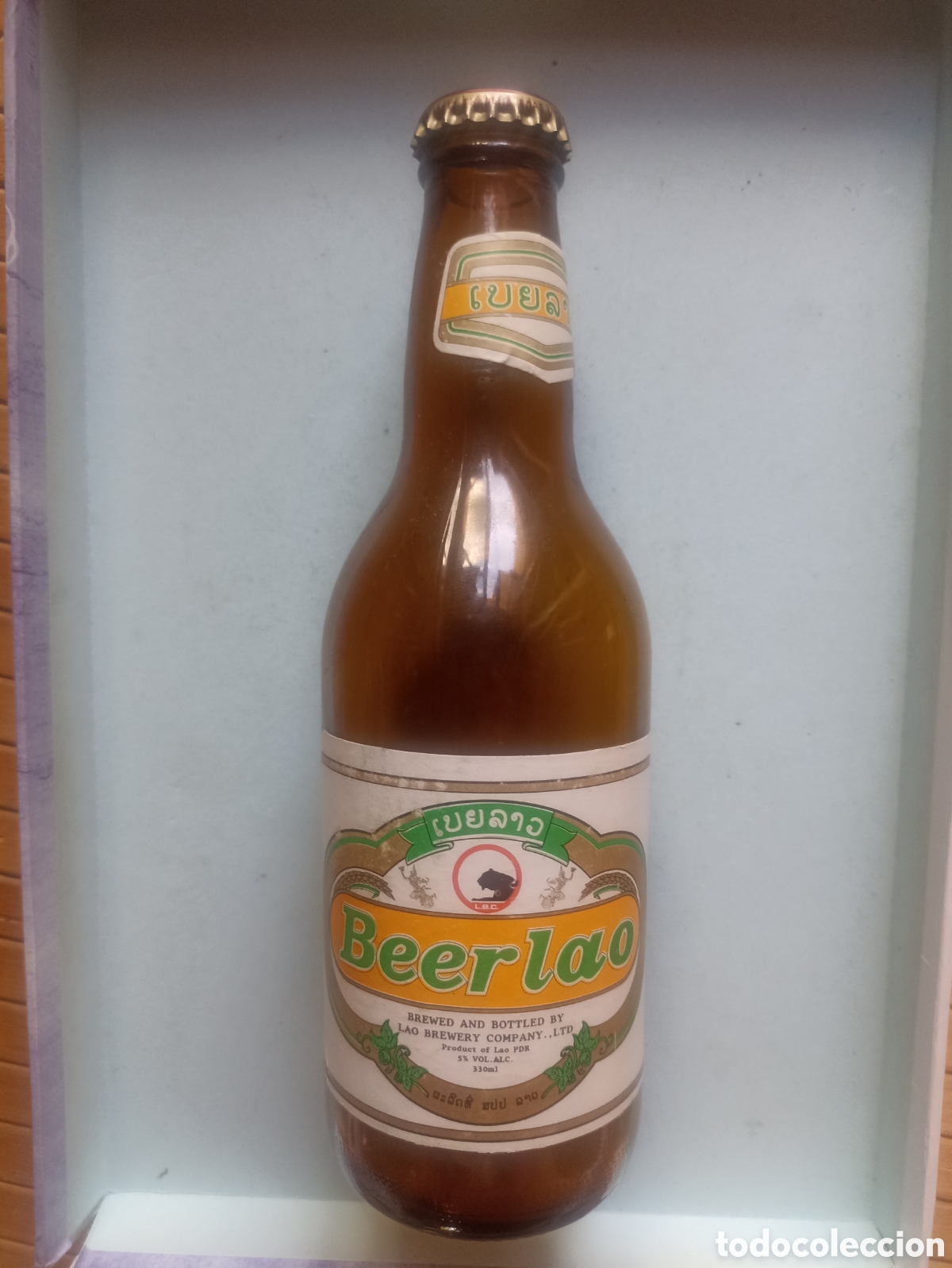 Coleccionismo de cervezas: Botella cerveza Beerlao vac&iacute;a con chapa 330 ml