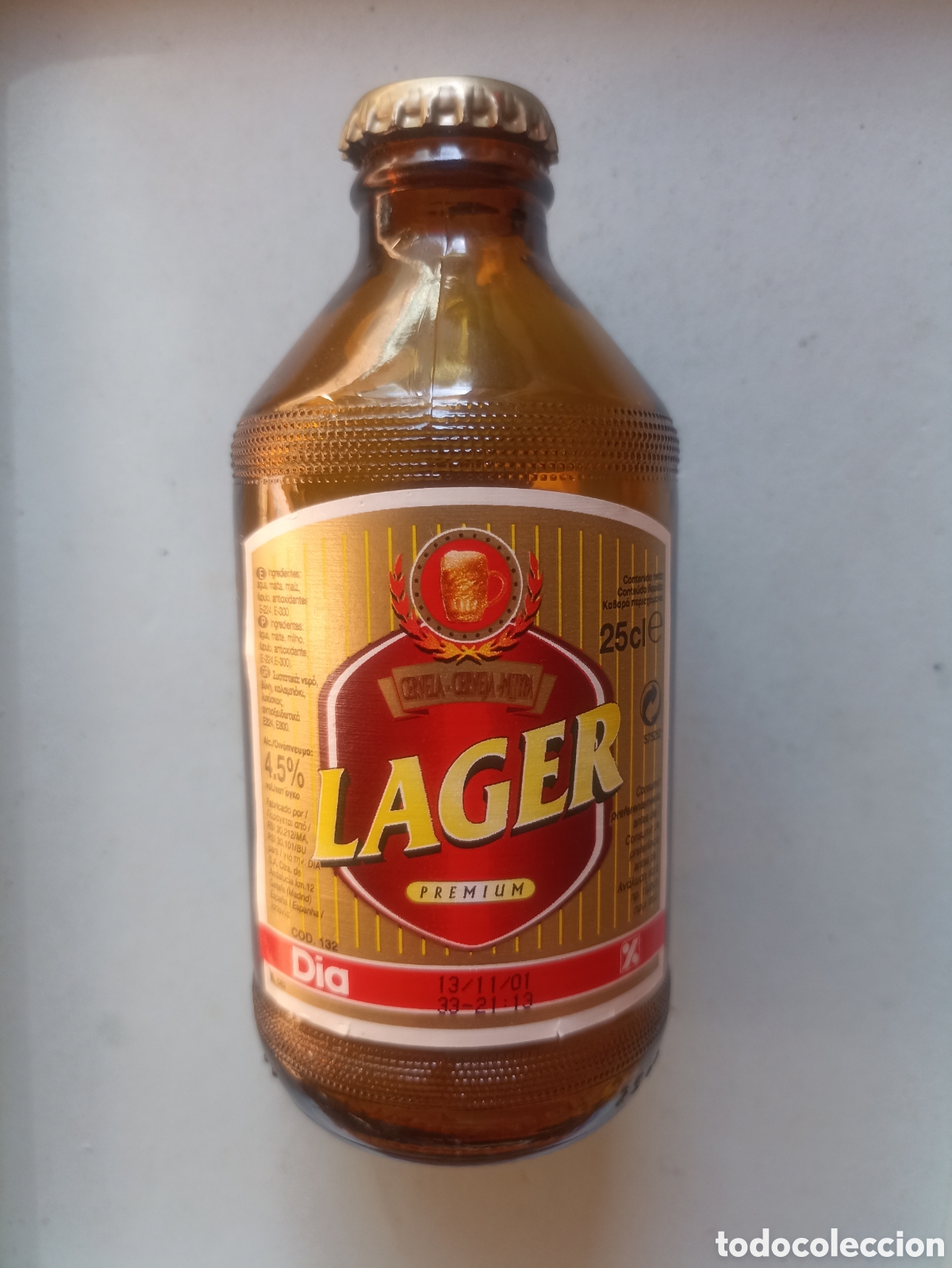 Coleccionismo de cervezas: Botella cerveza D&iacute;a lager premium vac&iacute;a con chapa 250 ml