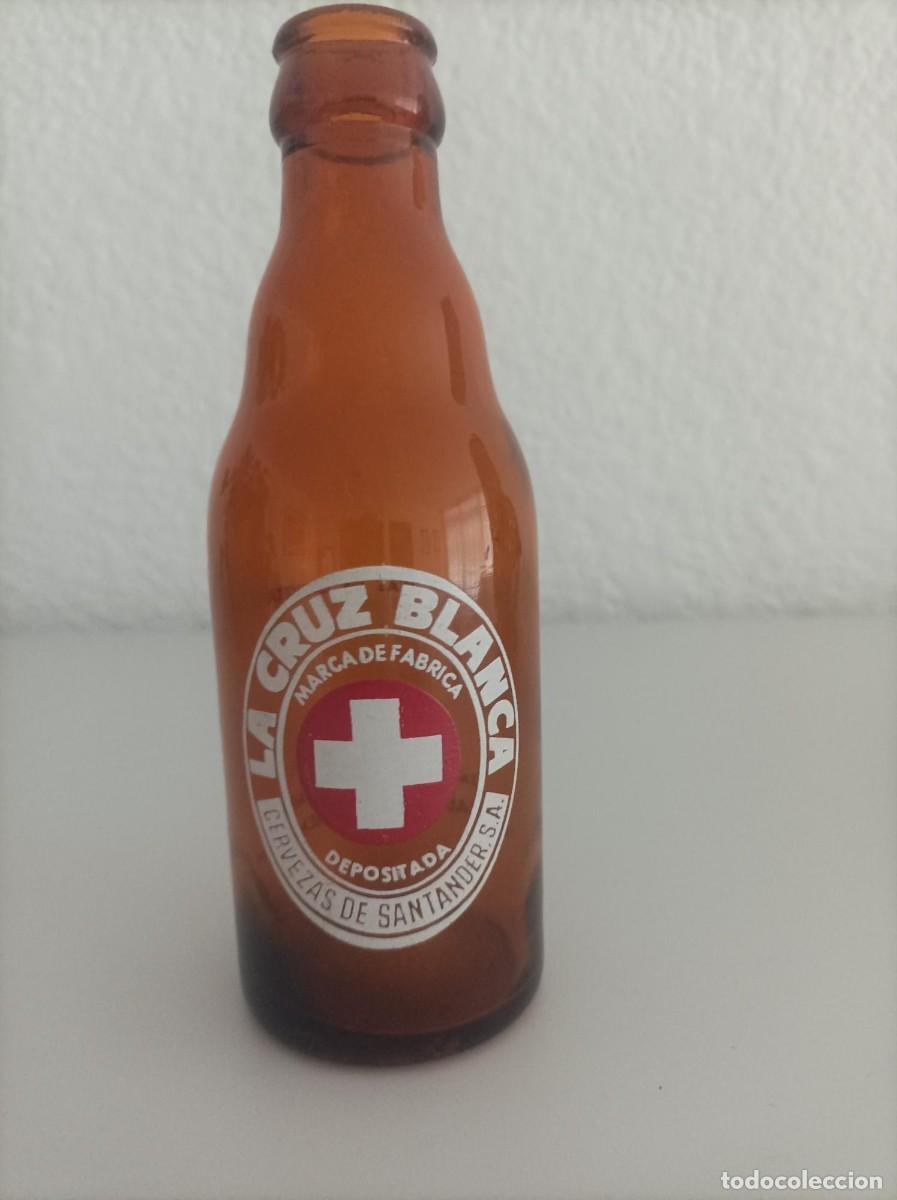 Coleccionismo de cervezas: Botellin de cerveza La Cruz Blanca