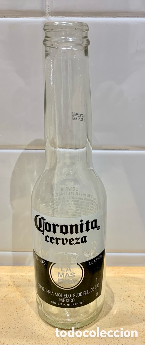 Coleccionismo de cervezas: Botella de vidrio. Cerveza CORONITA. 210 cc.