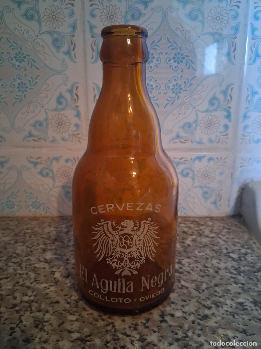 Coleccionismo de cervezas: Botella cerveza El aguila negra Colloto Oviedo Asturias tercio
