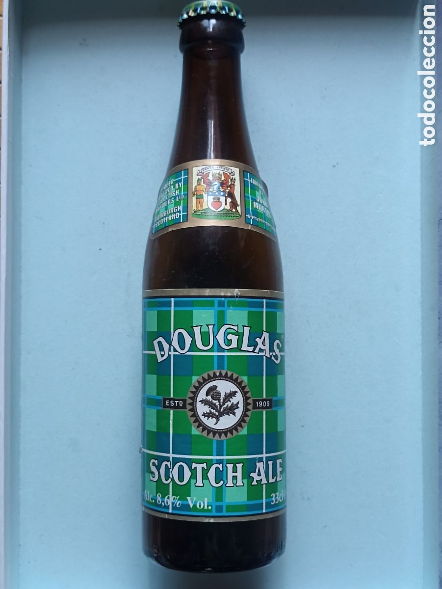 Coleccionismo de cervezas: Botella cerveza Douglas Scotch Ale vac&iacute;a con chapa 330 ml
