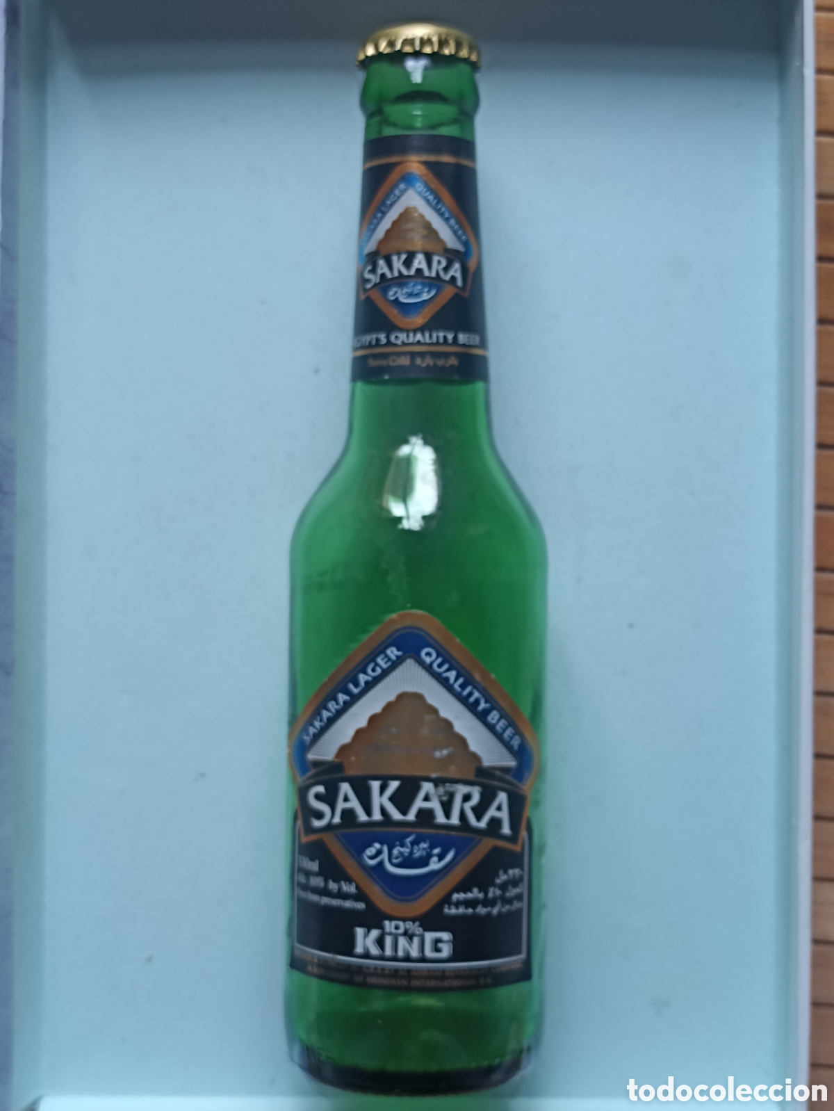 Coleccionismo de cervezas: Botella cerveza Sakara vac&iacute;a con chapa 330 ml