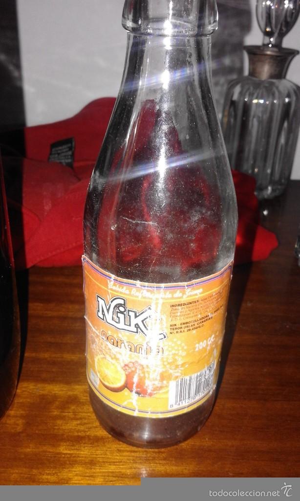 Colecionismo de Coca-Cola e Pepsi: Antigua botella botell&iacute;n a&ntilde;os 90 de refrescos Teror embotelladora el pino Nik Naranja etiqueta