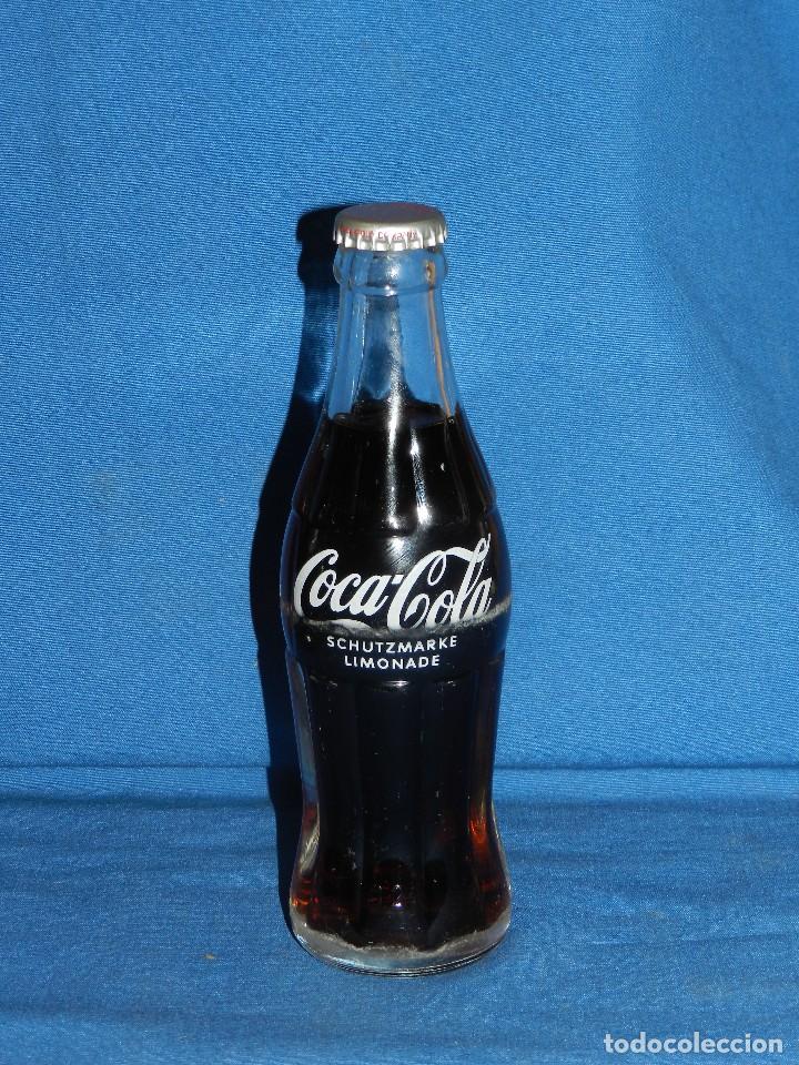 Sammeln von Coca-Cola und Pepsi: (A31) BOTELLA COCA-COLA ANTIGUA LLENA CON CHAPA ALEMANA , 0'2L , SE&Ntilde;ALES DE USO