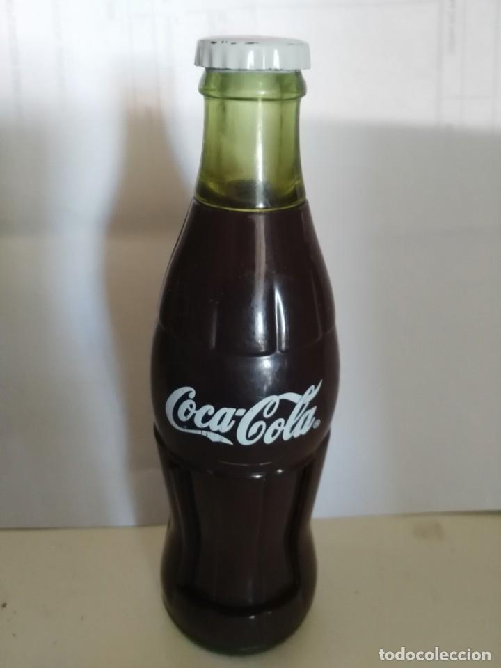 Collezionismo di Coca-Cola e Pepsi: botella de plastico decorativa con puerta