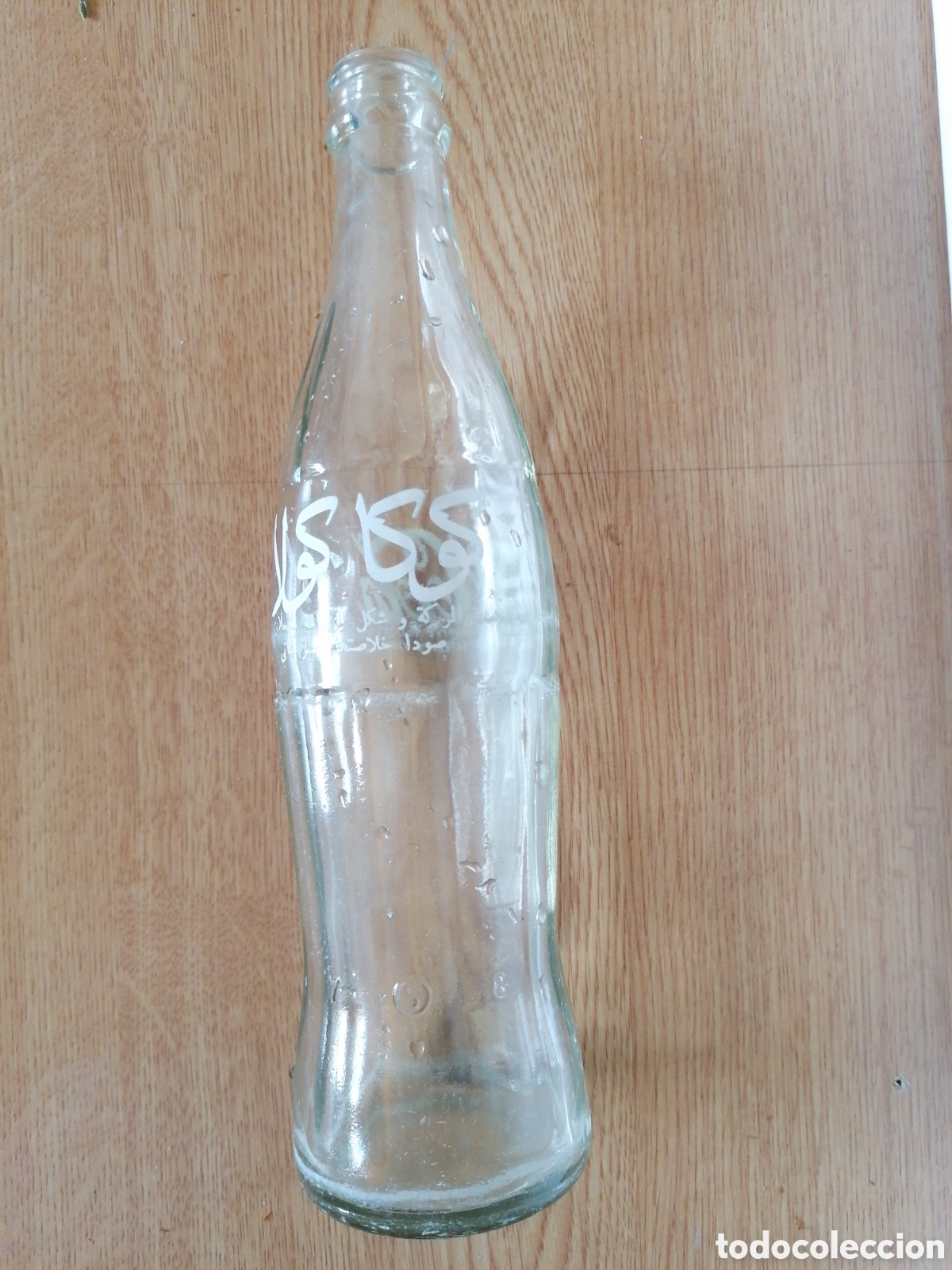 Coleccionismo de Coca-Cola y Pepsi: Antigua botella de Coca Cola letras &aacute;rabes.