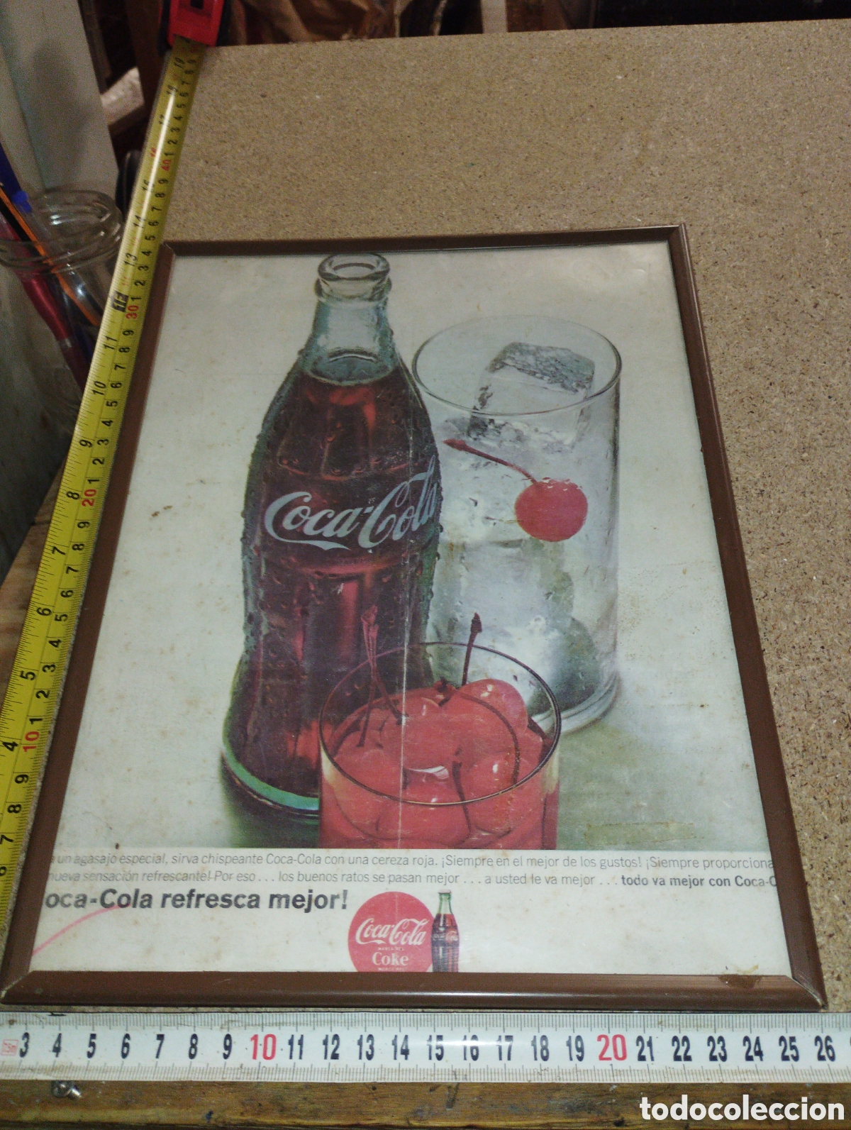 Collecting of Coca-Cola and Pepsi: Lamina de Coca Cola enmarcado con alguna doblez