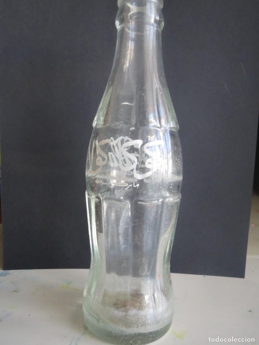 Sammeln von Coca-Cola und Pepsi: botella de cocacola en arabe