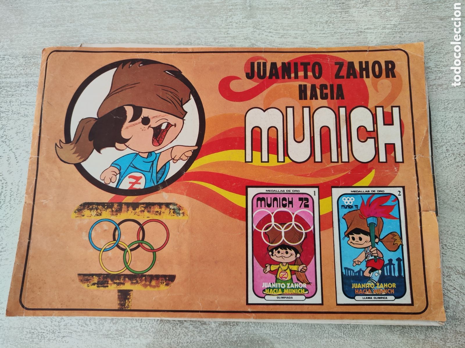 Coleccionismo deportivo: &Aacute;lbum incompleto a falta de 3 cromos Juanito chocolates Zahor olimpiadas Munich 1974