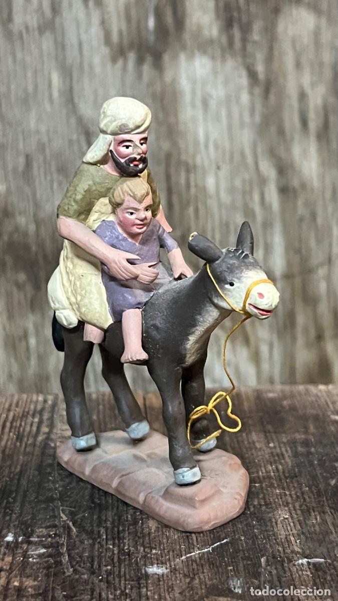 Figuras de Bel&eacute;n: Figura Belen hombre con burro y ni&ntilde;o turbante barro pintado mitad s XX MURCIA 10x8cms