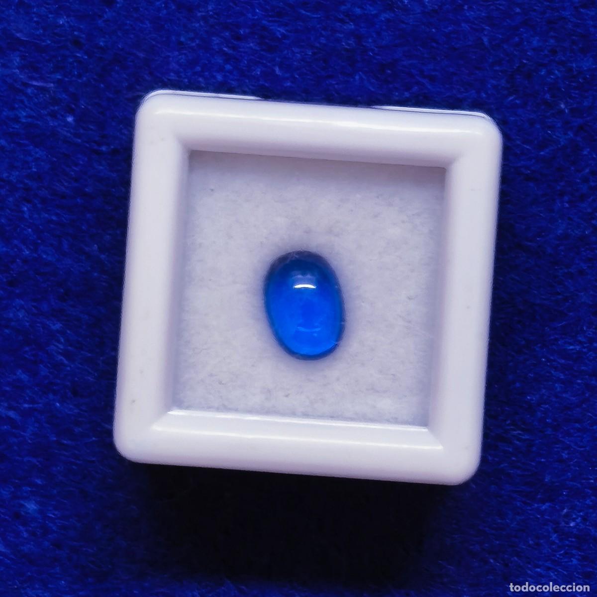 Sammlung von Edelsteinen: ZAFIRO AZUL RECONSTITUIDO EN TALLA CABUJON MED. 6 X 4 MM.PESO 0,59 CTS