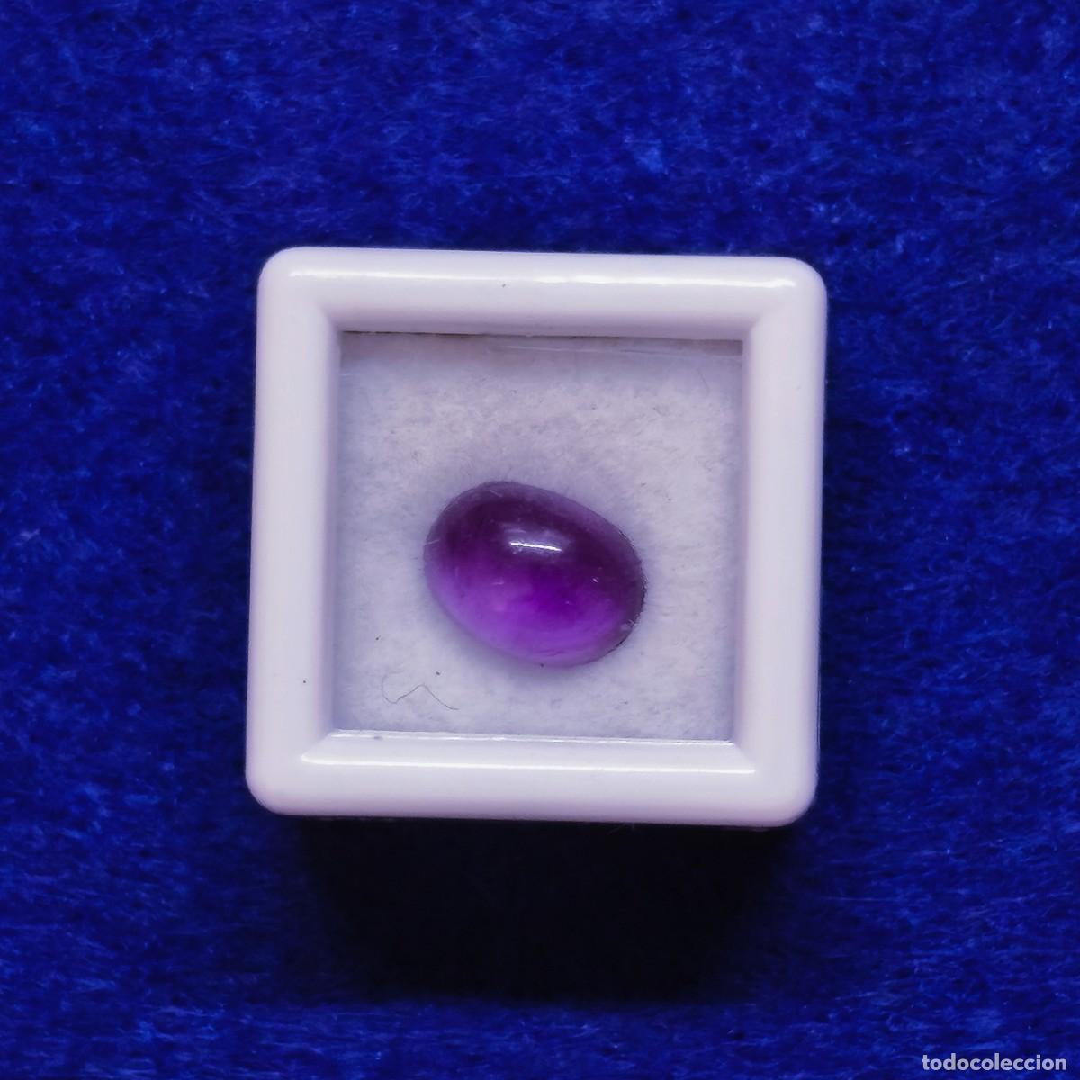 Sammlung von Edelsteinen: AMATISTA NATURAL TALLA OVAL CABUJON. MED. 8 X 6. PESO 1,42 CTS