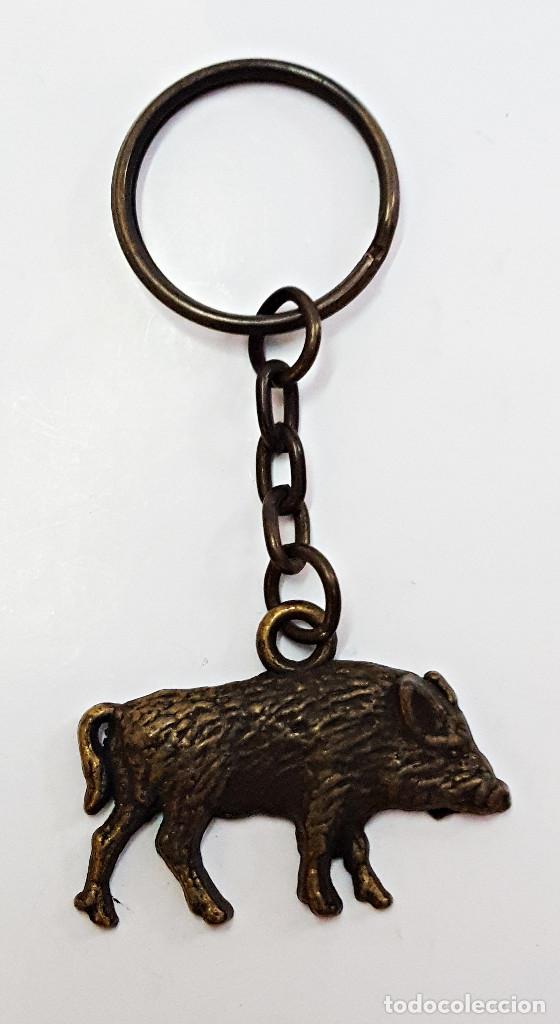Collectionnisme de portes-cl&eacute;s: Llavero con JABALI en metal una cara color bronce.