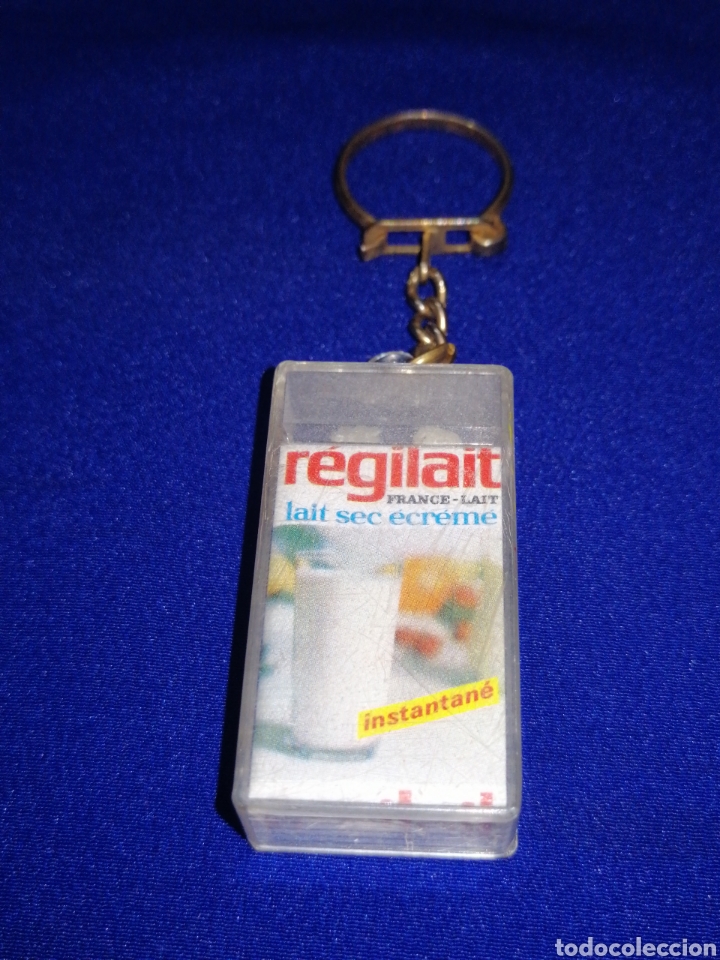 Collectionnisme de portes-cl&eacute;s: REGILAT LAIT SECREME LLAVERO PUBLICIDAD FRANCIA