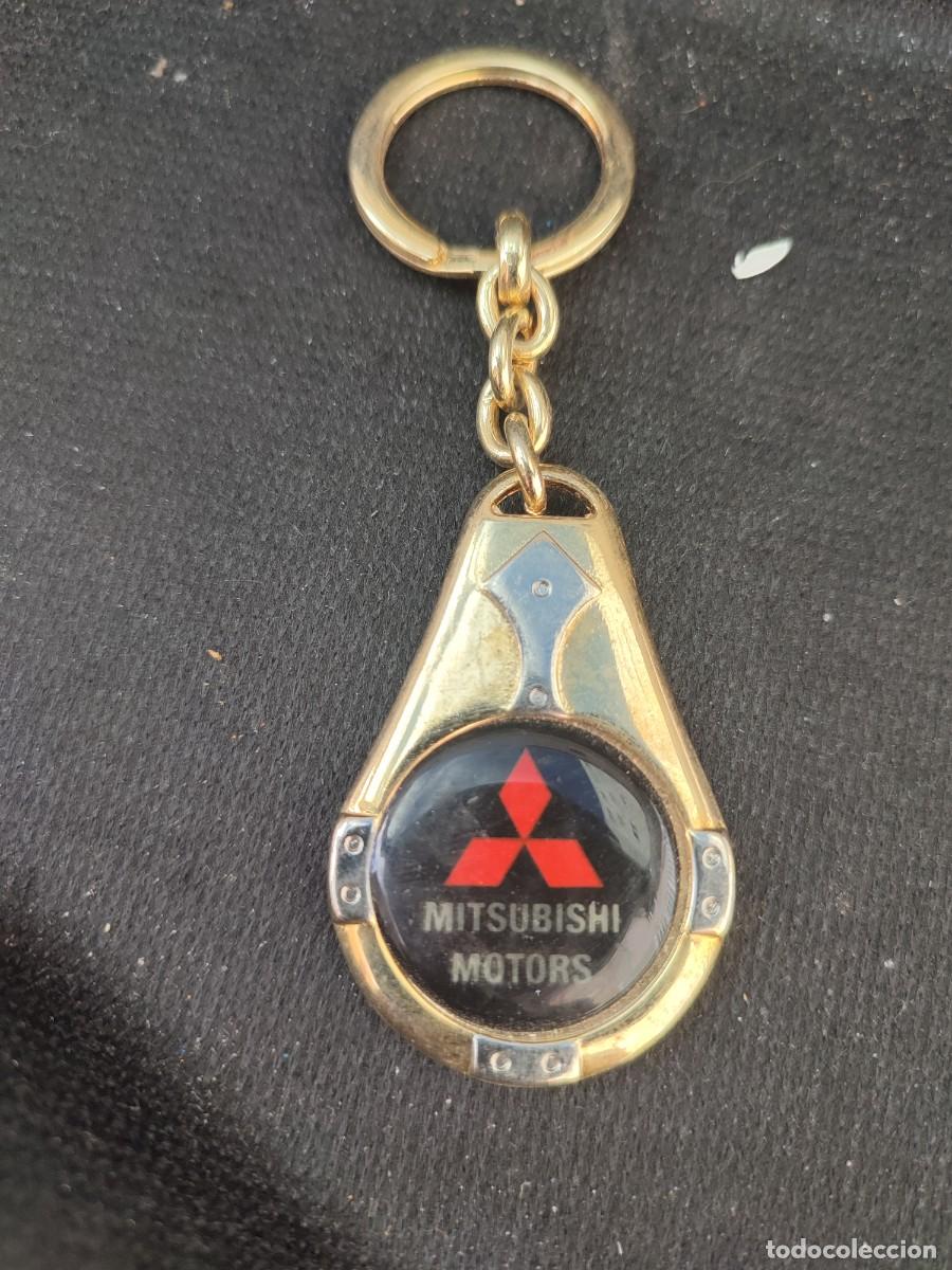Coleccionismo de llaveros: Llavero met&aacute;lico marca coche anagrama met&aacute;lico dorado Mitsubishi