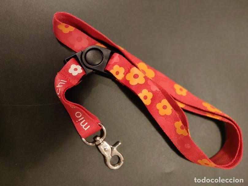 Collection of Keychains: CINTA COLGANTE PARA LLAVES TARJETAS ETC - CON MOSQUETON. 'MIO AMICHI'.