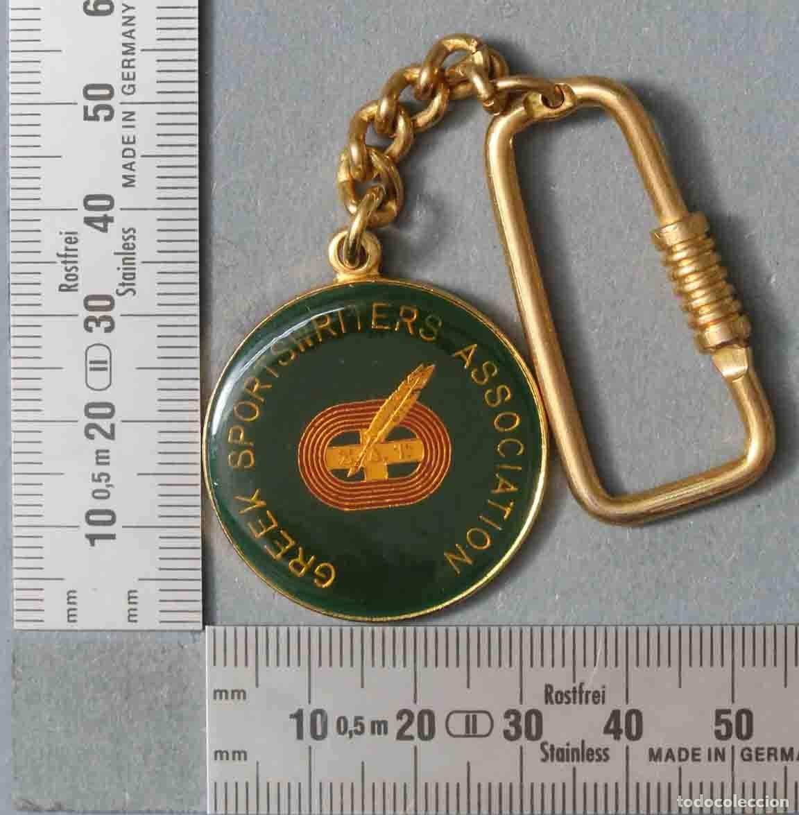 Collection of Keychains: LLAVERO. GREEK SPORTSWRITERS ASSOCIATION. ATHENS 96&acute;. THE GOLDEN OLYMPICS