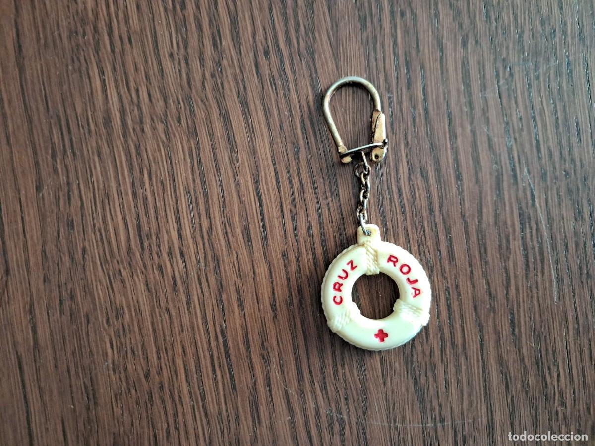 Colecionismo de porta-chaves: llavero de pl&aacute;stico de publicidad, cruz roja.