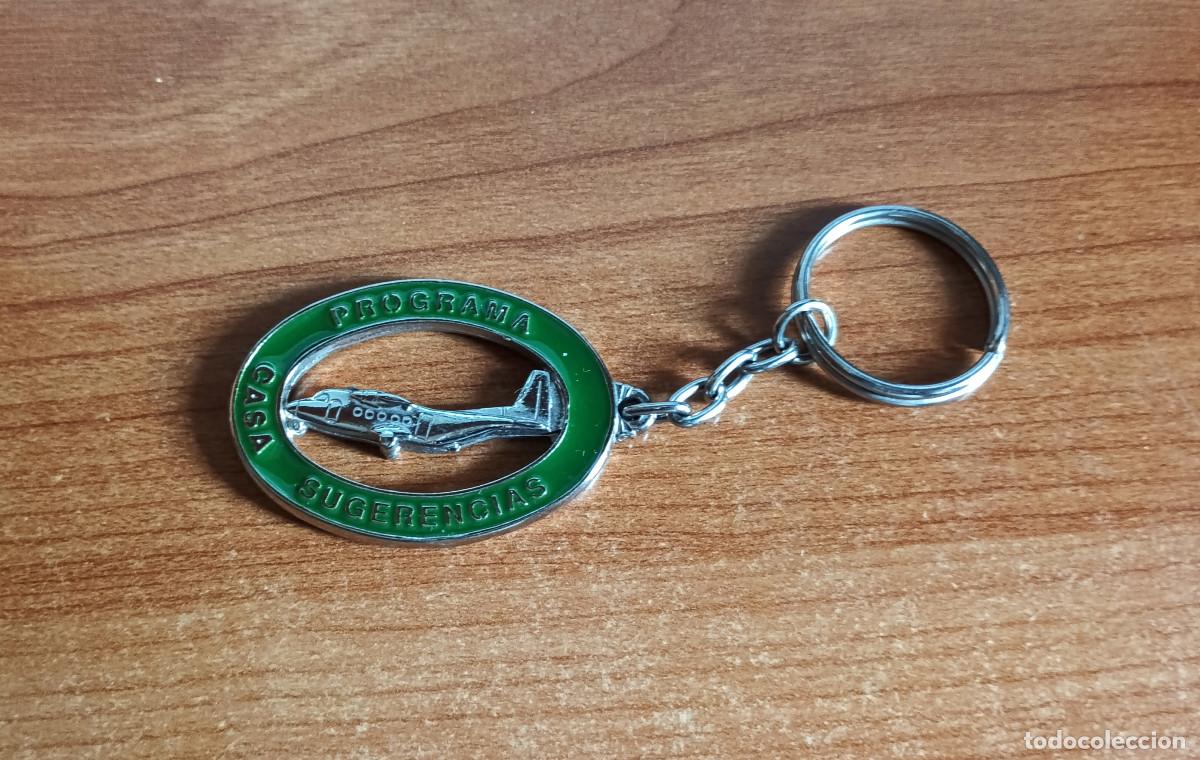 Collectionnisme de portes-cl&eacute;s: Llavero de metal de CASA con avi&oacute;n