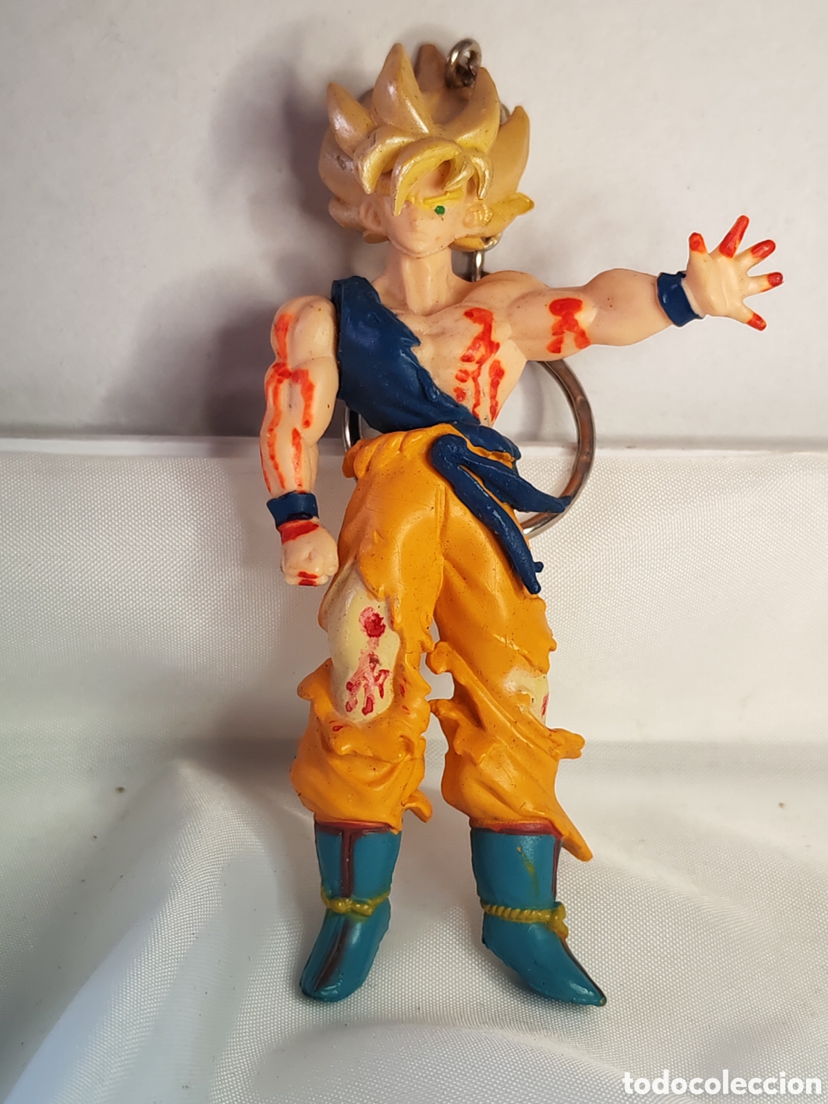 Coleccionismo de llaveros: Llavero coleccionable Goku Super Saiyan. Con dise&ntilde;o da&ntilde;o de batalla. Dragon Ball Z. (CL)