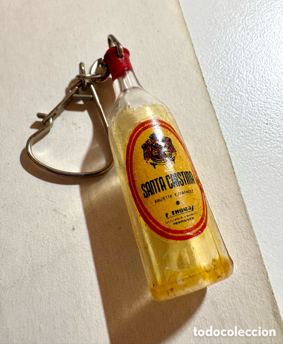 Sammlung von Schl&uuml;sselanh&auml;ngern: Llavero Botella Anisette Santa Cristina - F. Thomaz (A&ntilde;os 60)
