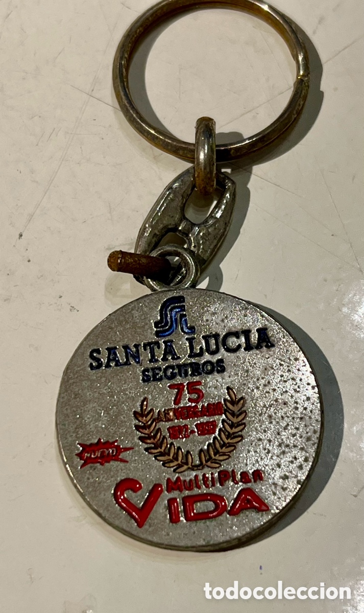 Coleccionismo de llaveros: Llavero. Santa Luc&iacute;a Seguros. 75 Aniversario. Metal. 1997.