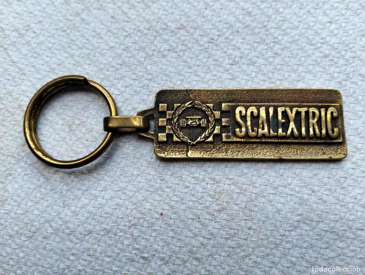 Sammlung von Schl&uuml;sselanh&auml;ngern: Llavero antiguo metal color dorado scalextric