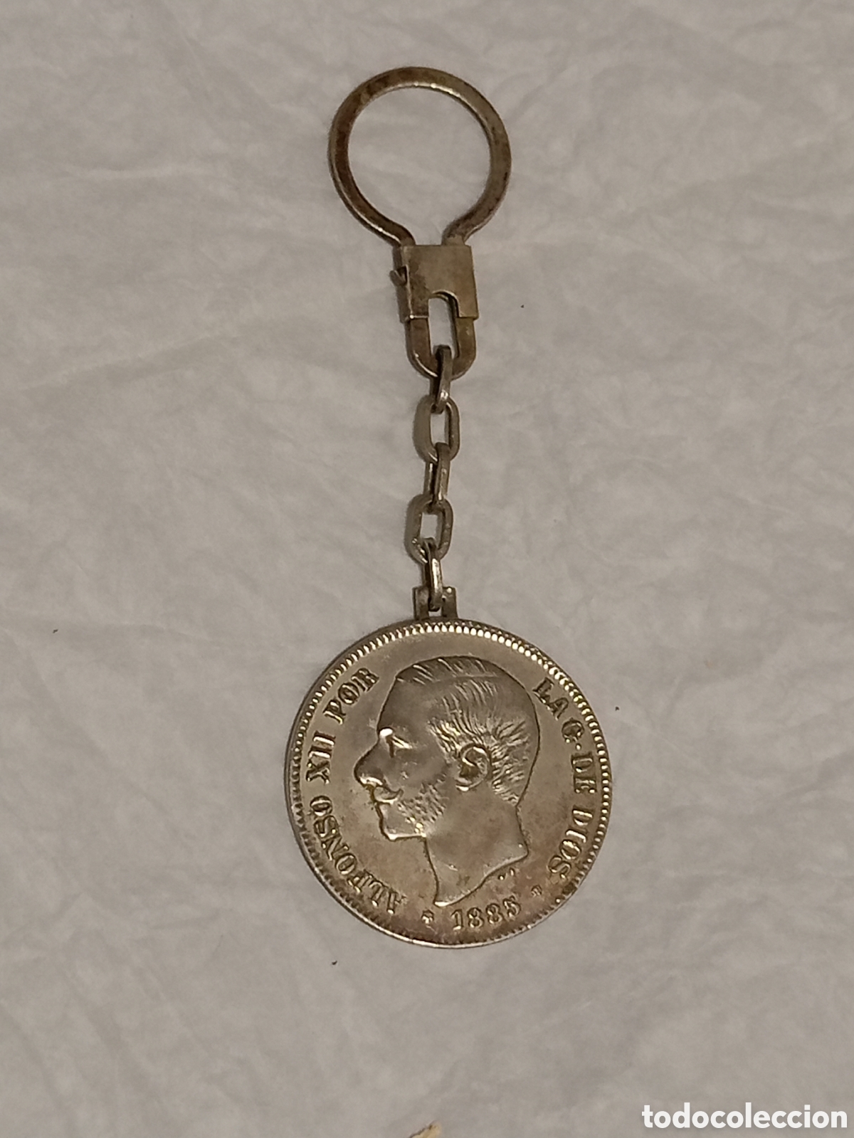 Collectionnisme de portes-cl&eacute;s: Llavero moneda imitaci&oacute;n 5 pesetas Alfonso XII