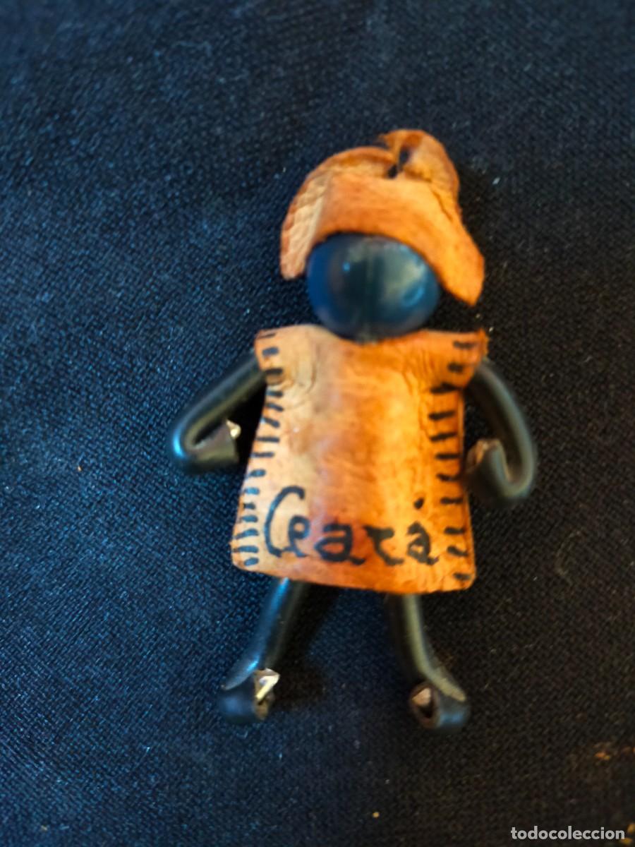 Collection of Keychains: FIGURA FOLCL&Oacute;RICA DE LLAVERO. VINTAGE BRASIL. 70&acute;s. CON CUERO Y SEMILLAS PROTECTORAS OLHO