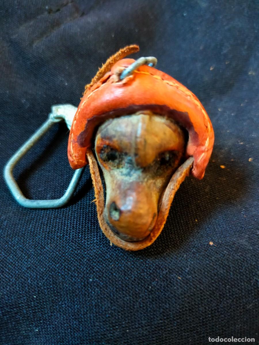 Collection of Keychains: FIGURA FOLCL&Oacute;RICA DE LLAVERO. VINTAGE BRASIL. 70&acute;s. CON CUERO Y SEMILLAS PROTECTORAS OLHO