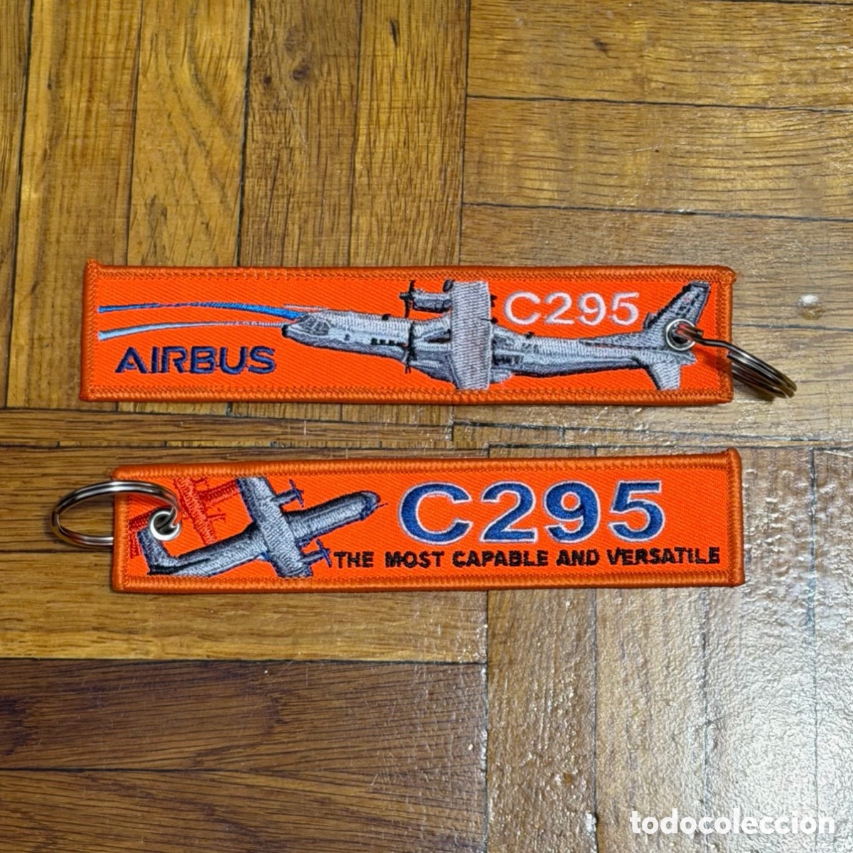 Coleccionismo de llaveros: Llavero bordado Airbus C295 naranja doble cara