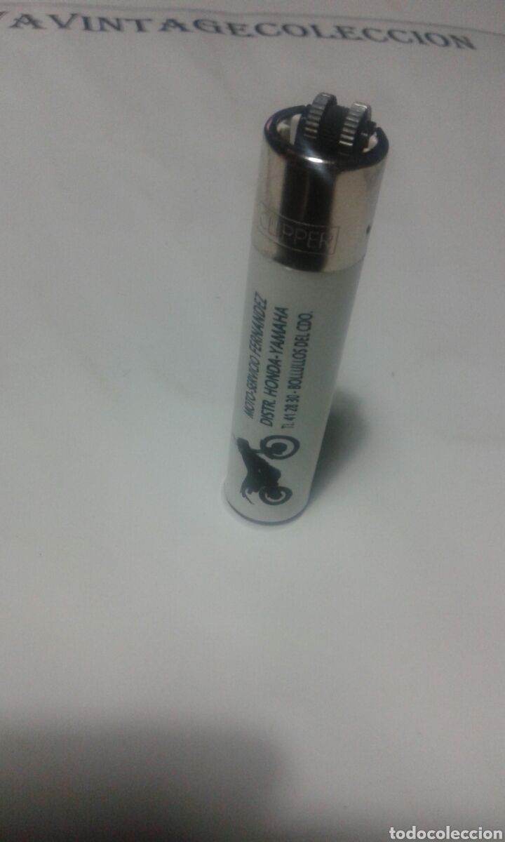 Mecheros: Mechero clipper con rascador redondo y publicidad.
