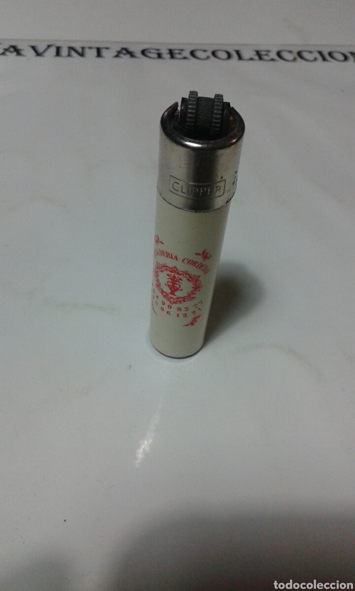 Mecheros: Mechero clipper con rascador redondo y publicidad.